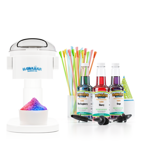 Front view of S700 machine with rainbow snow cone (red, purple, and blue), in ice mold directly below it. To the left is a front view of 3 16-oz pints, which are Cherry (Red), Blue Raspberry (Blue) and Grape (Purple). Below these pints are three black bottle pourers. To the left and slightly behind of the pints is a stack of green snow cone cups. Behind the pints are a display of spoon straws. 